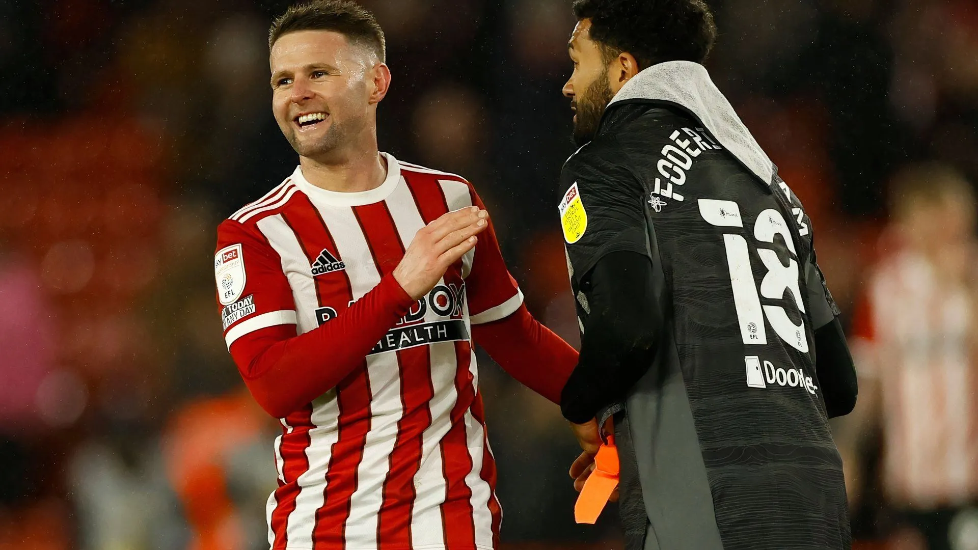Tiền vệ Oliver Norwood ăn mừng cùng Sheffield United, khẳng định vai trò quan trọng và di sản của anh tại Bramall Lane qua những lần thăng hạng.